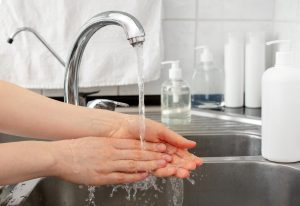 Woman washing hands with antibacterial soap and water. Hygiene concept. Coronavirus protection hand antiseptic hygiene. Skin disinfectant for healthcare.