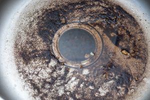 Dirty Sink at kitchen room. Clean a sink drain. unclog a kitchen sink without a disposal