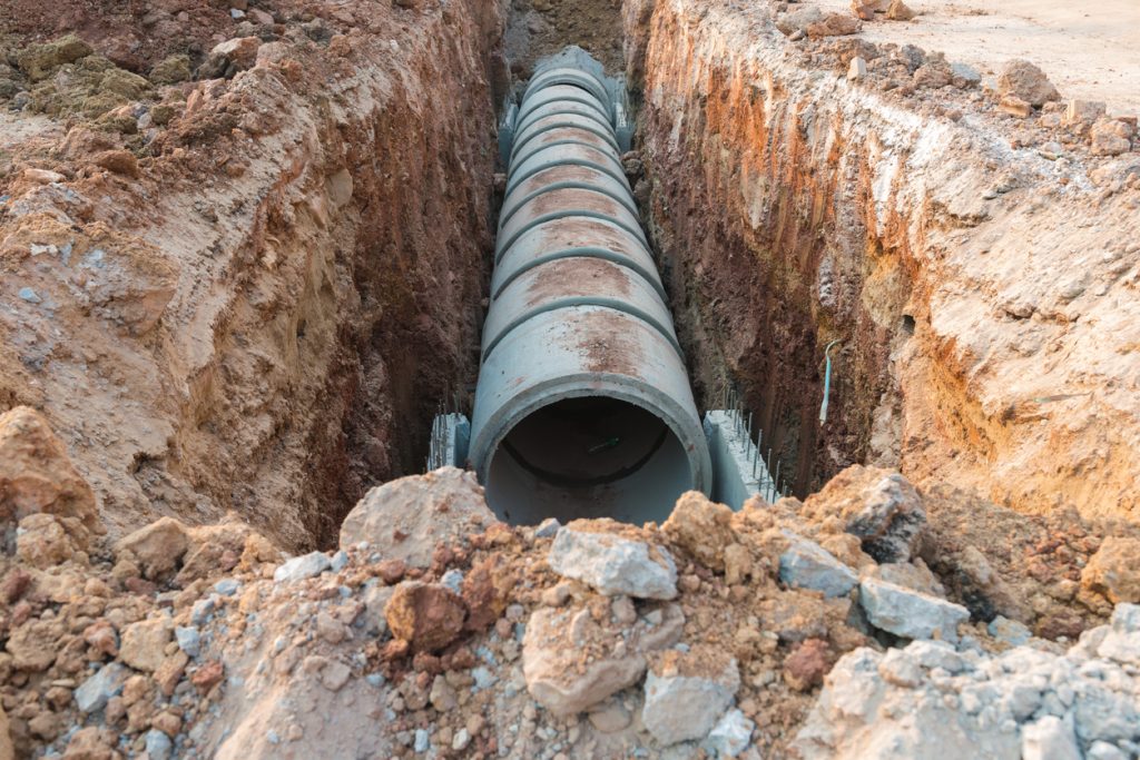 Concrete drainage pipe near the construction industry