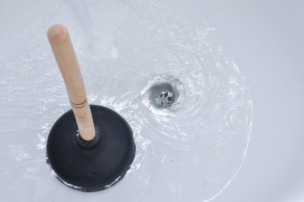 Plunger and clogged bath drain